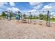 Community playground with swings, slides, and other recreational activities at 19195 Blue Pond Dr, Lutz, FL 33558