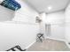 Spacious walk-in closet with ample shelving to keep everything organized at 19195 Blue Pond Dr, Lutz, FL 33558