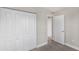 This bedroom features carpeted floors and a closet for storage at 21042 Gladis Ave, Port Charlotte, FL 33952