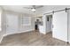 Living room with plank floors, sliding barn door, and view into the updated kitchen at 21042 Gladis Ave, Port Charlotte, FL 33952
