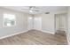 Bright living room featuring stylish plank floors, ceiling fan, and neutral paint at 21042 Gladis Ave, Port Charlotte, FL 33952