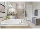 Bright bathroom with a soaking tub, walk-in shower, and stylish tile at 2835 Hilliard Dr, Wesley Chapel, FL 33543