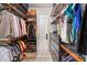 Spacious walk-in closet with custom organizers, shelves, and hanging rods for optimal storage at 2835 Hilliard Dr, Wesley Chapel, FL 33543