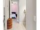 Tiled hallway view to bright bedroom with pink wall at 2835 Hilliard Dr, Wesley Chapel, FL 33543