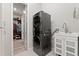 Modern laundry room with stacked washer and dryer, plus a convenient utility sink at 2835 Hilliard Dr, Wesley Chapel, FL 33543