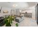 Open-concept living space with a modern kitchen and dining area, and tile flooring at 2835 Hilliard Dr, Wesley Chapel, FL 33543
