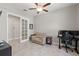 Well-lit office featuring a comfortable couch, modern desk setup, and neutral tones at 2835 Hilliard Dr, Wesley Chapel, FL 33543