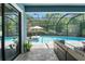 Refreshing pool surrounded by lush greenery, perfect for hot summer days at 2835 Hilliard Dr, Wesley Chapel, FL 33543