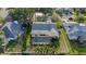 Aerial view of a home featuring a screened pool, fenced yard, and mature landscaping at 2969 Talon Dr, Clearwater, FL 33761