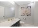 Charming powder room with decorative mirror, modern fixtures, and patterned tile floor at 2969 Talon Dr, Clearwater, FL 33761