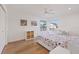 Bright bedroom with ceiling fan, desk, and closet at 2969 Talon Dr, Clearwater, FL 33761