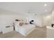 Well-lit bedroom featuring plush carpet, a ceiling fan, and a bright desk area at 2969 Talon Dr, Clearwater, FL 33761
