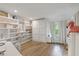 Comfortable bedroom with built-in shelving, a murphy bed, and soft natural lighting at 2969 Talon Dr, Clearwater, FL 33761