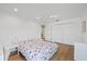Bedroom features a bed, closet, and ceiling fan at 2969 Talon Dr, Clearwater, FL 33761