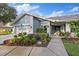 Beautiful home with meticulously maintained landscaping and a stone walkway at 2969 Talon Dr, Clearwater, FL 33761