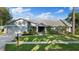 Inviting home featuring mature landscaping, a well-kept lawn, and a welcoming entrance at 2969 Talon Dr, Clearwater, FL 33761