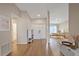 Hallway with hardwood floors leading into a well-lit room at 2969 Talon Dr, Clearwater, FL 33761