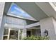 Front entrance featuring modern architectural details and neutral exterior color scheme at 2969 Talon Dr, Clearwater, FL 33761