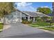 Charming single-Gathering home with well-maintained landscaping, two car garage and neutral exterior color scheme at 2969 Talon Dr, Clearwater, FL 33761
