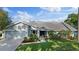 Charming single-Gathering home with well-maintained landscaping, two car garage and neutral exterior color scheme at 2969 Talon Dr, Clearwater, FL 33761