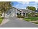 Charming single-Gathering home with well-maintained landscaping, two car garage and neutral exterior color scheme at 2969 Talon Dr, Clearwater, FL 33761