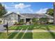 Charming single-story home featuring a landscaped front yard and attached two-car garage at 2969 Talon Dr, Clearwater, FL 33761