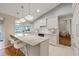 Kitchen with a breakfast bar, modern lighting, and stainless steel appliances at 2969 Talon Dr, Clearwater, FL 33761