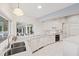 Bright eat-in kitchen featuring white cabinetry, countertops, and stainless steel sink at 2969 Talon Dr, Clearwater, FL 33761