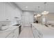 Bright eat-in kitchen features white cabinetry, a large island, and stainless steel appliances at 2969 Talon Dr, Clearwater, FL 33761