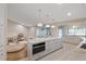 Open concept kitchen features marble countertops, stainless steel appliances, and a large island at 2969 Talon Dr, Clearwater, FL 33761