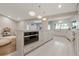 Spacious kitchen with marble countertops, stainless steel appliances and adjacent play area at 2969 Talon Dr, Clearwater, FL 33761