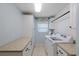 Well-organized laundry room with storage and counter space at 2969 Talon Dr, Clearwater, FL 33761