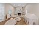 Spacious living room with a fireplace and built in shelves at 2969 Talon Dr, Clearwater, FL 33761