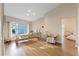 Well-lit living room with wood floors, neutral tones, and pilates machine at 2969 Talon Dr, Clearwater, FL 33761