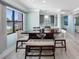 Bright dining area featuring a wooden table with seating at 3210 Gulf Blvd # 108, Belleair Beach, FL 33786