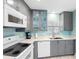 Well-equipped kitchen with modern appliances, sleek countertops, and ample cabinet space at 3210 Gulf Blvd # 108, Belleair Beach, FL 33786