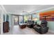 Cozy living room with comfortable seating and sliding doors to the outdoor patio at 3210 Gulf Blvd # 108, Belleair Beach, FL 33786