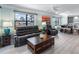 Open-concept living room with comfortable seating and dining area at 3210 Gulf Blvd # 108, Belleair Beach, FL 33786