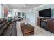 Inviting living room featuring comfortable seating and an open layout to the dining area at 3210 Gulf Blvd # 108, Belleair Beach, FL 33786