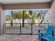 Outdoor patio with seating overlooking the lush landscaping at 3210 Gulf Blvd # 108, Belleair Beach, FL 33786