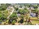 An aerial view showing the mature trees and landscaping of this home's lot in a quiet neighborhood at 3225 Bea Ct, Land O Lakes, FL 34639