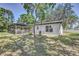 Spacious backyard featuring a screened-in patio, perfect for outdoor relaxation at 3225 Bea Ct, Land O Lakes, FL 34639