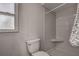 Standard bathroom with a white toilet and shower combo at 3225 Bea Ct, Land O Lakes, FL 34639