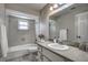Clean, well-maintained bathroom with tub, tiled walls, and sleek fixtures at 3225 Bea Ct, Land O Lakes, FL 34639