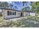Charming single-story home with a well-manicured lawn and covered entryway at 3225 Bea Ct, Land O Lakes, FL 34639