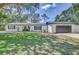 Charming single-story home with well-maintained lawn and clean curb appeal at 3225 Bea Ct, Land O Lakes, FL 34639