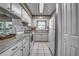 Bright kitchen featuring white appliances and marble tile, offering a clean, modern cooking space at 3225 Bea Ct, Land O Lakes, FL 34639