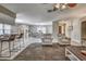 Open-concept living room leading to a dining area with seating and a breakfast bar at 3225 Bea Ct, Land O Lakes, FL 34639