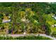 Aerial view of the property with boundary lines, showcasing its size and surrounding greenery at 3226 Palmetto Rd, Wimauma, FL 33598