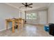 Dining room with tile floors, a ceiling fan, and a large window overlooking the backyard at 3226 Palmetto Rd, Wimauma, FL 33598